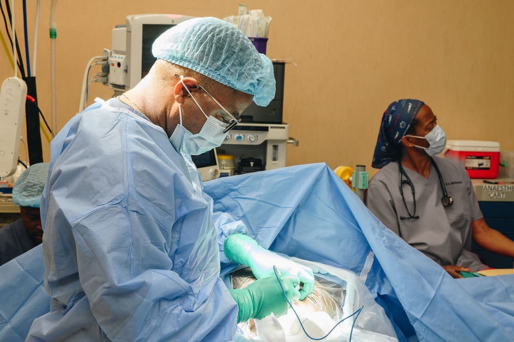 Dr Makanda operating in theatre at Melomed Private Hospital, Mitchells Plain, with the anaesthetist alongside