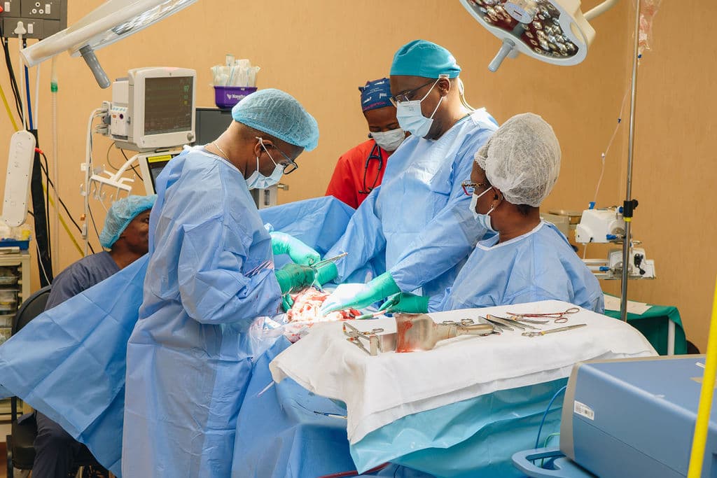 Dr Makanda operating with the theatre team, including an assisting surgeon, the scrub nurse and the anaesthetist, at Melomed Private Hospital, Mitchells Plain